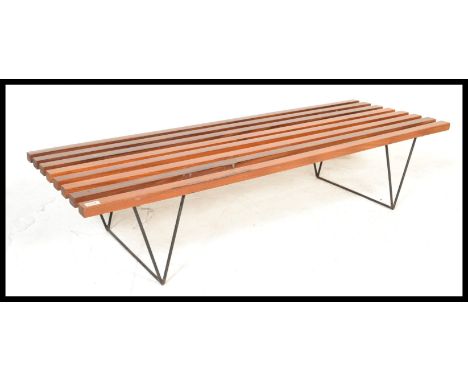 A vintage 20th Century Robin Day Hille For Day Bench&nbsp;lido style slatted bench of good proportions raised on ebonised hai