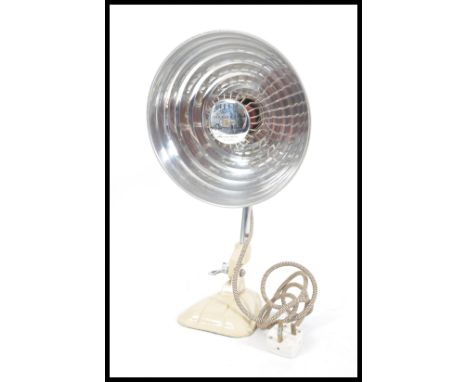 A vintage mid century Pifco heat lamp with UFO Space age style pendant shade raised on adjustable neck and cast metal base. M