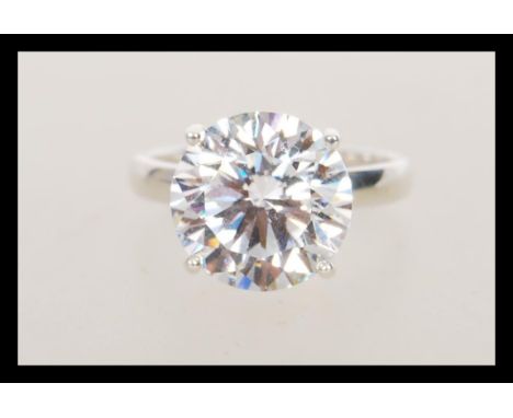 A stamped 925 silver dress ring set with a large cubic zirconia of approx 8ct's. Weight 5.8g. Size O.