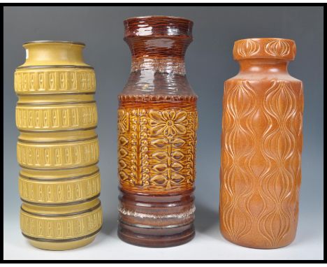 A group of three vintage retro 20th Century West German fat lava style pottery floor standing vases / stick stands. Includes 