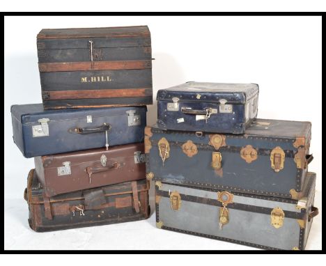 A collection of 20th century steamer trunks and suitcases dating to the early and middle part of the 20th century including m