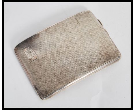 An early 20th Century hallmarked silver cigarette case by&nbsp;W T Toghill &amp; Co. The case of shaped bowed rectangular for