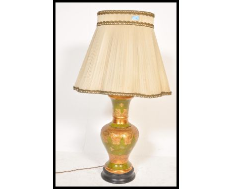 A 20th Century Chinese Satsuma style table lamp of bulbous form, the bulbous body on green ground with gilt bordered decorati