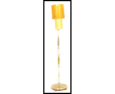 A vintage early 20th century Antique style marble and brass floor standing lamp raised on paw feet with round base with centr