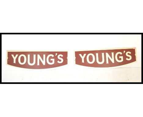 A pair of vintage retro 20th Century Advertising point of sale enamel sins for Youngs Beer in red and white. Measures 85 cm x
