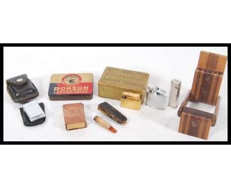 A collection of vintage 20th Century smoking related items to include a Ronson Service Outfit tin, a Ronson lighter with engi