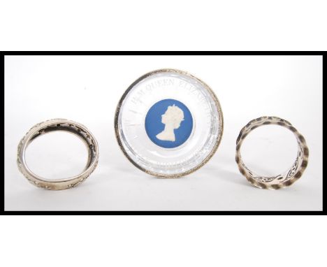 Two silver hallmarked napkin rings with repousse decoration (both hallmarked Birmingham 1907 &amp; 1908, weight 34.3g)&nbsp; 