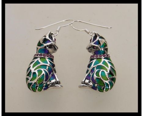 A pair of stamped 925 silver plique a jour earrings in the form of cats having ruby accent stones set to the collars. Weight 