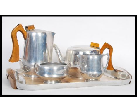 A vintage mid 20th Century Piquet Ware pewter coffee service, consisting of pots, creamer, sugar bowl and matching liner / tr