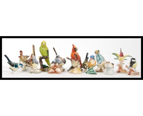 A collection of vintage 20th Century ceramic bird figurines to include Goebel birds and a selection of birds marked Italy, to