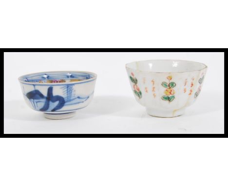 Two early 19th Century Chinese porcelain tea bowls comprising of an example having a blue and white exterior with good gilded