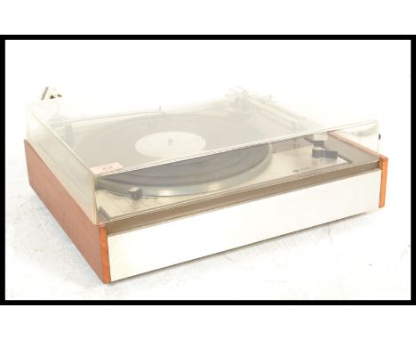 A vintage 20th Century Leak Lenco record player deck fitted within a brushed chrome and teak case.