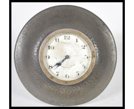 A vintage Liberty of London Tudric 20th Century desk clock having a Arabic numeral chapter ring with a hammered pewter collar