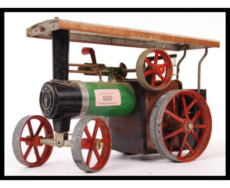A Vintage 20th Century Mamod TE1A steam tractor / traction engine The tractor with green enamel body and red painted wheels, 