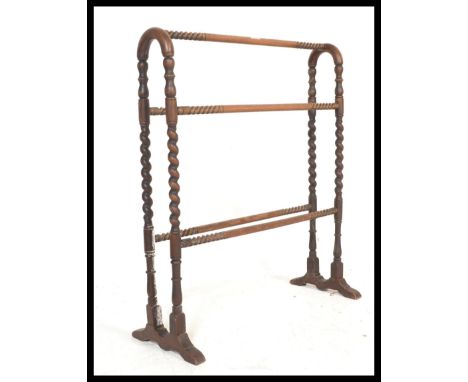 A 19th Century Victorian mahogany barley twist / bobbin turned towel rail with arched top. Measures 85 cm high x 73 cm wide x
