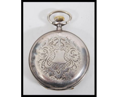 An early 20th Century Russian silver full hunter pocket watch having engraved decoration to the case with an unmarked armoria