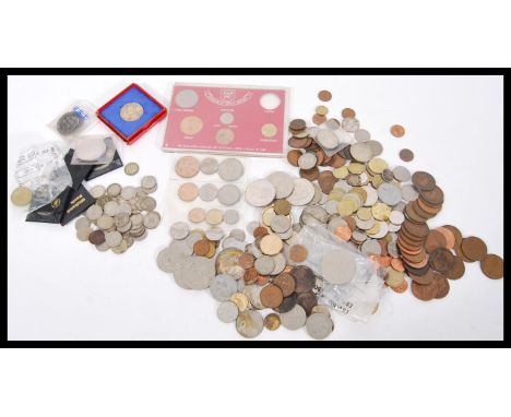 A collection of all world coins including pre-decimal silver sixpences, various American US coins etc.
