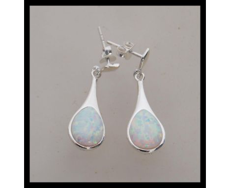 A pair of stamped 925 silver earrings set with opal panel drops. Stud backed. Weight 4.2g. Drops measure 3cm.&nbsp;