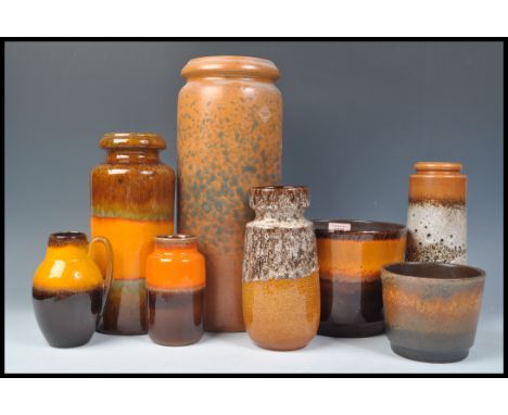 A collection of vintage retro 20th Century West German fat lava style pottery all in an orange flambe type colourway to inclu