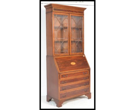 A George III 18th century style mahogany and marquetry inlaid&nbsp; bureau bookcase. Raised on bracket feet with a bank of dr