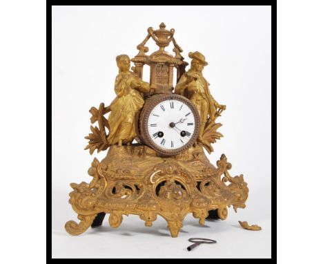 A late 19th Century Victorian&nbsp;French ormolu Boudoir Clock, in the rococo style with enamel dial and Roman numerals, rais