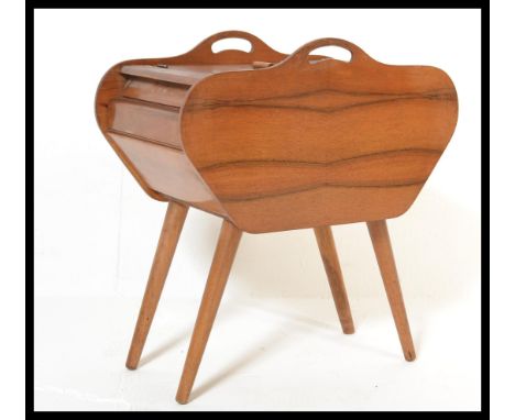 A vintage mid 20th Century black walnut concertina metamorphic work / sewing box, carry handles to the top raised on splayed 