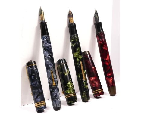 A Parker Duofold red marbled fountain pen with 14K gold nib, a Conway Stewart 388 blue mottled fountain pen with 14ct gold ni