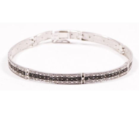 A 9ct white gold, diamond and black moissanite panel link bracelet, stated weight 0.25cts, 18cm, 8.9g, 