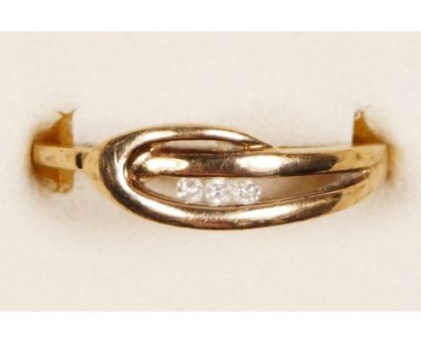 A 9ct gold and three brilliant cut diamond channel set ring , R, 2.6gm 