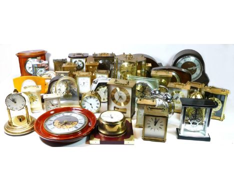 A collection of mid 20th century and later mantel clocks, having manual wind and later miniature novelty quartz examples. (4)