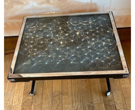 A 1970s Rank Industries of Leeds fibre optic occasional table, the chromed edge glass top having fibre optics set inside, wit