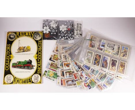 Postcards and collectors cards, to include Railway Locomotives by Prescott Pickup, tea cards of animals, cars, sportsmen, fis