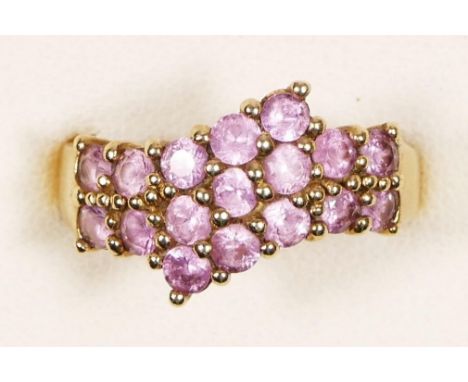 A 9ct gold pink sapphire dress ring, N 1/2, 3gm 