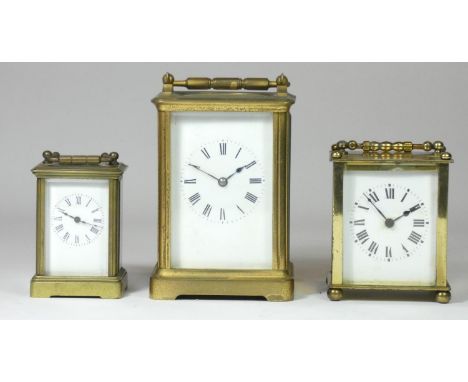 A square carriage clock, enamel dial with painted Roman numerals, movement unsigned, on bun feet, 9cm, together with a miniat