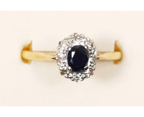 An 18ct gold sapphire and diamond cluster ring, R, 2.8gm 