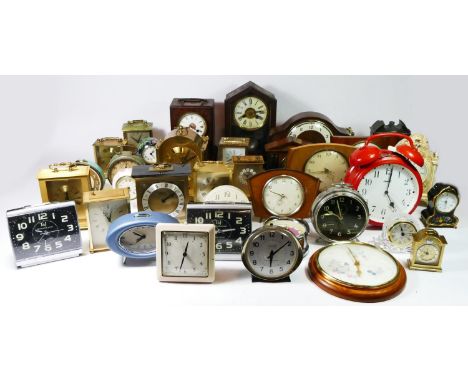 A collection of mid 20th century and later mantel clocks, alarm clocks and miniature novelty clocks, having manual wind and l