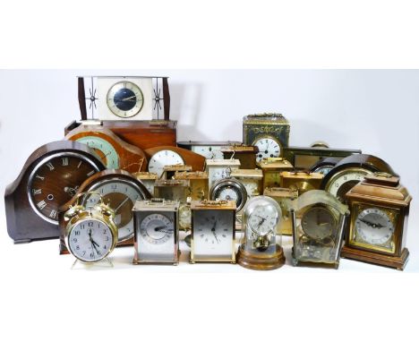 A collection of mid 20th century and later mantel clocks, carriage clocks, and alarm clocks to include manual wind and quartz
