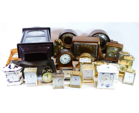 A collection of mid 20th century and later clocks, to include mantel clocks, traveling alarm clocks and wall clocks, having m