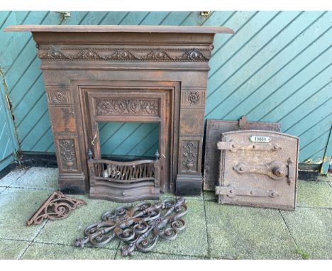 A Late 19th century cast iron fireplace, having stylised foliate decoration, overall size H119, W102, D32cm, together with tw