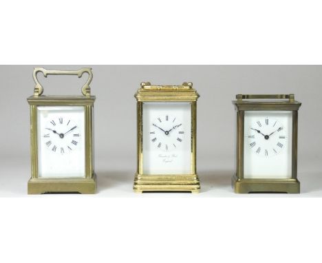 A carriage clock, to include a Thwaites &amp; Reed of London, four bevelled glass sides with balance wheel window, white dial