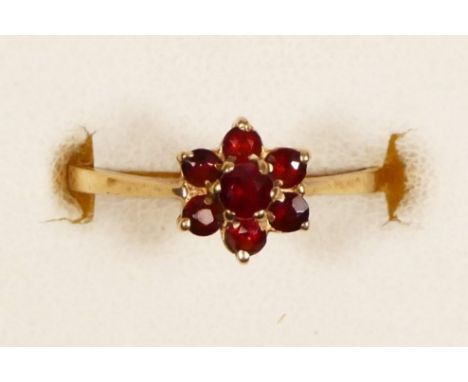 A 9ct gold and garnet cluster ring, K 1/2, 1.1gm 