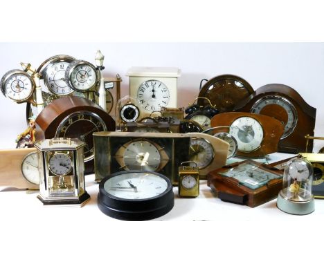 A collection of mid 20th century and later carriage, wall and mantel clocks, with manual wind and quartz movements. (4)
