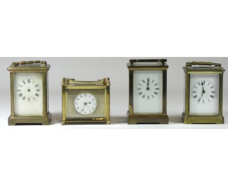 A rectangular carriage clock, painted enamel dial with Arabic numbers, gilt surround, balance wheel window, movement stamped 