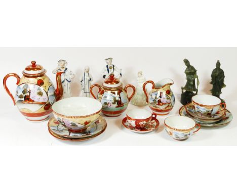 A pair of jade figurines, 18cm tall, together with a Japanese porcelain tea service and four ceramic figurines.