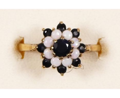 A 9ct gold sapphire and opal cluster ring, K 1/2, 2.1gm  the prongs at 2 O'clock and 4 0' clock at slightly bent - see pictur