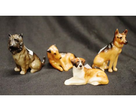 Four Royal Doulton K series dogs including K5 Airedale, K11 Cairn Terrier, K23 Alsatian and K19 St Bernard