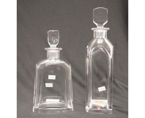 Two Orrefors cut crystal spirit decanters both etched to base, height 31cm approx