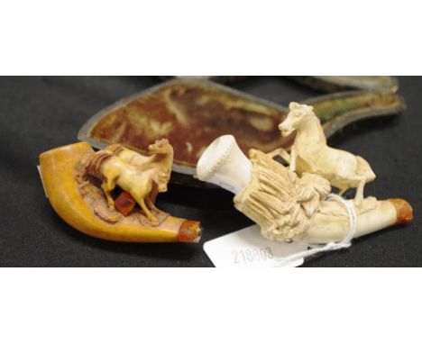 Two early carved meerschaum pipe end depicting a horses, 8cm wide approx with original lined case and 6cm wide