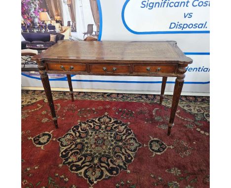 Regency Style Mahogany Writing Table The beaded rectangular top with eared corners and inset with tooled tobacco coloured lea