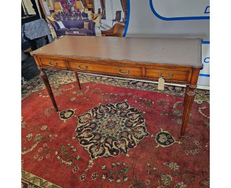Regency Style Mahogany Writing Table The beaded rectangular top with eared corners and inset with tooled tobacco coloured lea